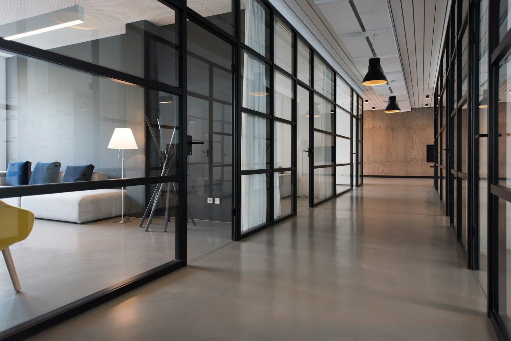 Glass-walled meeting rooms in a quiet office